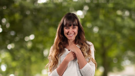 Caucasian-woman-looking-happy-with-trees-in-background