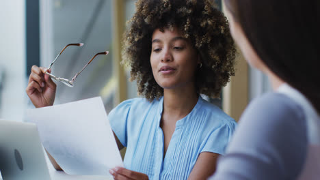 Diverse-business-colleagues-in-discussion-at-a-casual-meeting-in-the-office