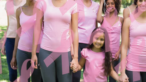 Animation-of-multiple-pink-ribbon-logo-over-diverse-group-of-smiling-women