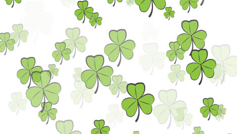 Digital-animation-of-multiple-clover-leaves-floating-against-white-background