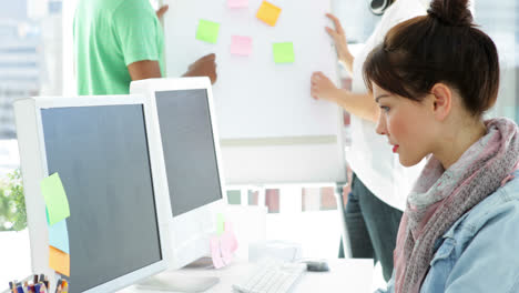 concentrated-creative-manager-working-at-her-desk-