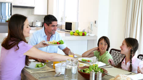 Happy-family-having-dinner-together