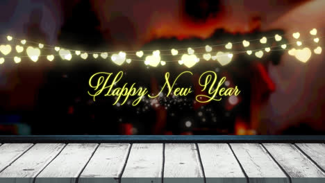 Animation-of-fairy-lights-and-happy-new-year-text-over-wooden-boards