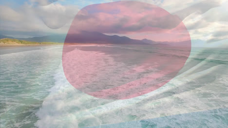 Digital-composition-of-waving-japan-flag-against-aerial-view-of-the-beach