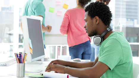 Focused-male-creative-designer-working-on-his-computer-