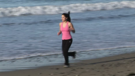 Woman-Jogging-on-Beach