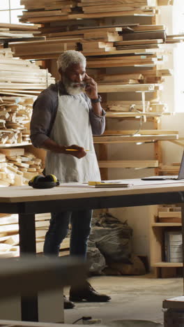 African-American-craftsman-in-a-woodworking-workshop,-with-copy-space