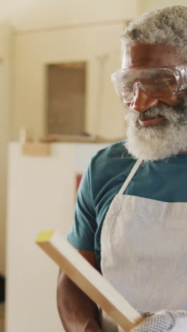 Skilled-African-American-craftsman-operates-a-drill-press-in-a-workshop