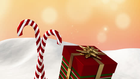 Animation-of-presents-and-christmas-candies-lying-on-snow-with-yellow-lights-falling-in-background