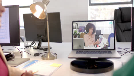 Laptop-with-video-call-with-african-american-businesswoman-on-screen