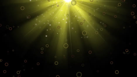 Animation-of-yellow-spots-and-bright-light-spot-against-black-background-with-copy-space