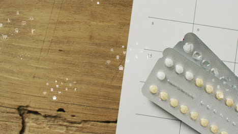 Animation-Mehrerer-Symbole-über-Tabletten-Auf-Rezeptpapier-Auf-Holztisch