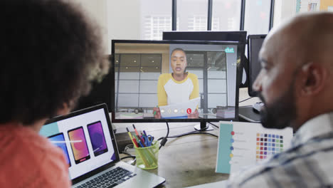 African-american-business-people-on-video-call-with-african-american-male-colleague-on-screen