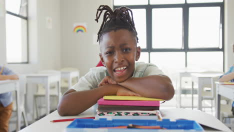 Animation-of-back-to-school-text-over-happy-african-american-schoolboy-at-school