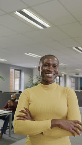 Vertical-video-of-portrait-of-happy-african-american-businesswoman-in-slow-motion