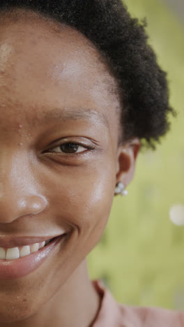 Vertical-video-of-portrait-of-happy-african-american-businesswoman-in-slow-motion