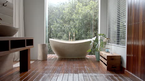 General-view-of-bathroom-with-bathtub-and-window,-slow-motion