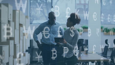 Animation-of-interface-with-currency-symbols-over-african-american-man-woman-discussing-at-office