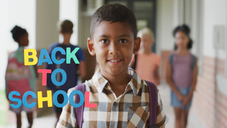 Animation-of-back-to-school-text-over-happy-biracial-schoolboy-at-school