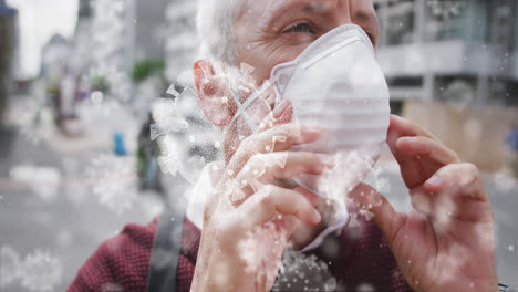 Animation-of-covid-19-cells-over-caucasian-man-wearing-face-mask