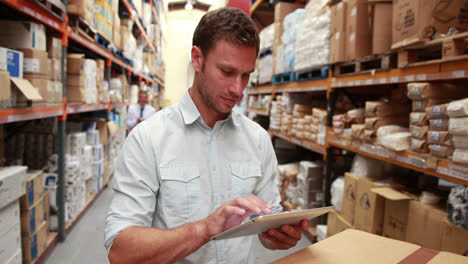 Warehouse-manager-using-his-tablet-pc