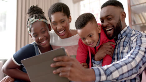 Happy-african-american-parents,-son-and-daughter-taking-selfie-at-home,-slow-motion