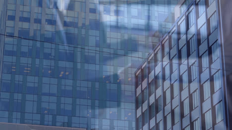 Composite-video-of-mid-section-of-businesspeople-shaking-hands-against-tall-buildings-in-background