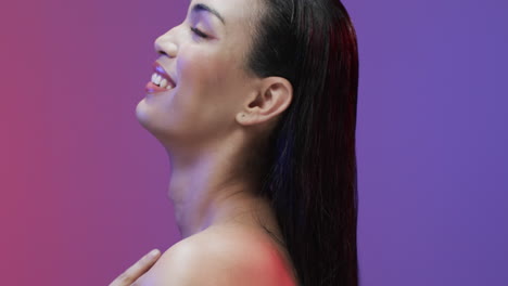 Side-view-of-smiling-biracial-woman-with-black-hair-and-make-up,-copy-space,-slow-motion