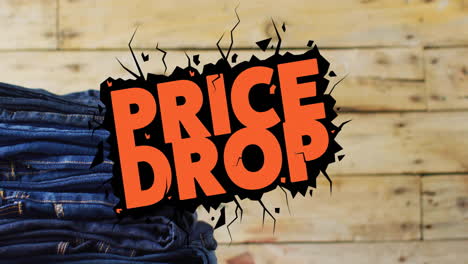 Animation-of-price-drop-text-over-denim-trousers-on-wooden-background