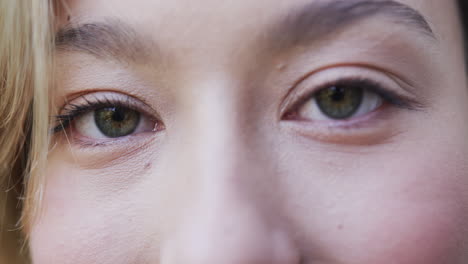 Close-up-of-portrait-of-happy-biracial-woman-with-blonde-hair,-slow-motion