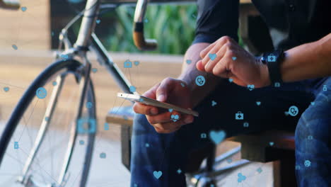 Animation-of-connected-icons,-biracial-man-looking-at-smartwatch-and-scrolling-on-cellphone