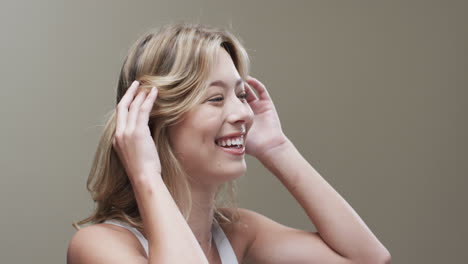 Portrait-of-smiling-caucasian-woman-with-blond-hair,-copy-space,-slow-motion