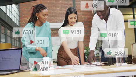 Animation-of-numbers,-icons-in-notification-bars,-diverse-coworkers-discussing-blueprint-in-office