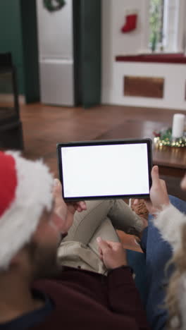 Vertical-video-of-diverse-couple-using-laptop-with-copy-space-on-screen,-in-slow-motion