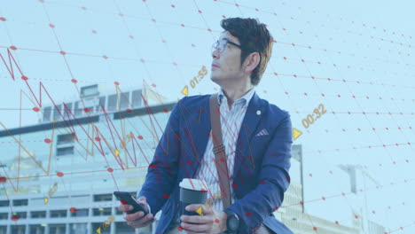 Animation-of-financial-data-processing-over-asian-businessman-using-smartphone-on-city-street