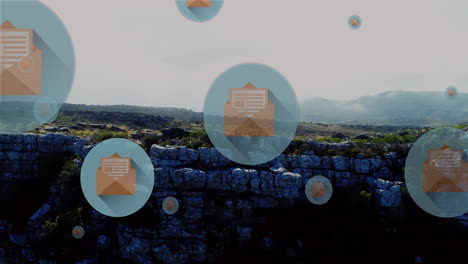 Animation-of-circles-with-envelope-icons-over-landscape