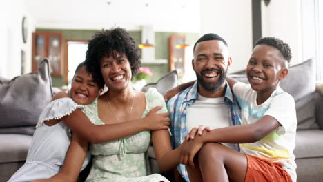 Happy-african-american-parents,-son,-daughter-and-grandmother-enjoying-summer-together,-slow-motion