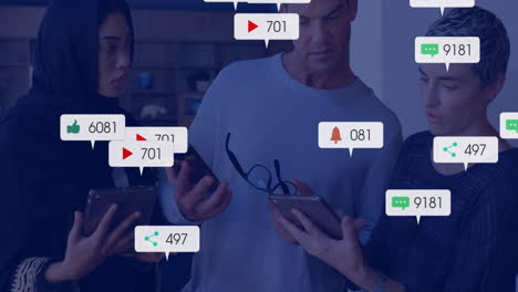 Animation-of-social-media-notifications-over-diverse-colleagues-using-tablets