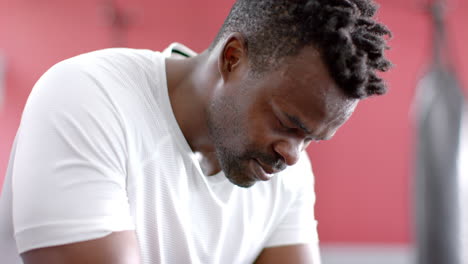 Fit-African-American-man-takes-a-break-at-the-gym