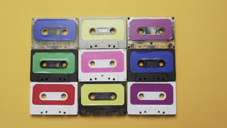 Video-of-retro-tapes-with-copy-space-on-yellow-background