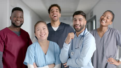 Diverse-medical-team-smiling-in-a-hospital-corridor