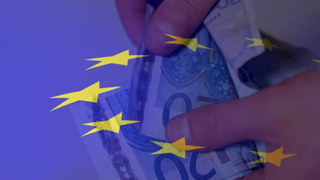 Animation-of-flag-of-european-union-over-euro-currency-bills