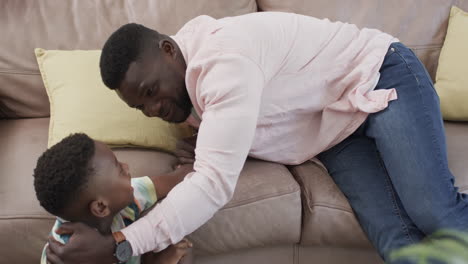 African-American-father-and-son-share-a-moment-at-home