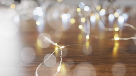 Animation-of-white-circles-over-christmas-lights