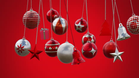 Animation-of-multicolored-baubles,-stars-and-bells-swinging-against-red-background