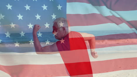 Animación-De-La-Bandera-De-Estados-Unidos-Sobre-Un-Superhéroe-Caucásico-En-La-Playa-En-Verano.