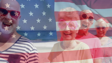 Animation-of-flag-of-usa-over-caucasian-senior-friends-on-beach-in-summer