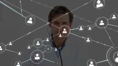 Animation-of-network-of-connections-with-icons-over-caucasian-male-doctor