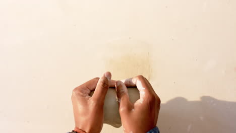 Diverse-group-of-male-and-female-potters-working-in-pottery-studio