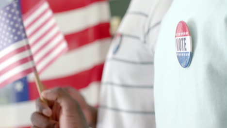 Close-up-of-a-'vote'-badge-on-a-shirt,-with-copy-space